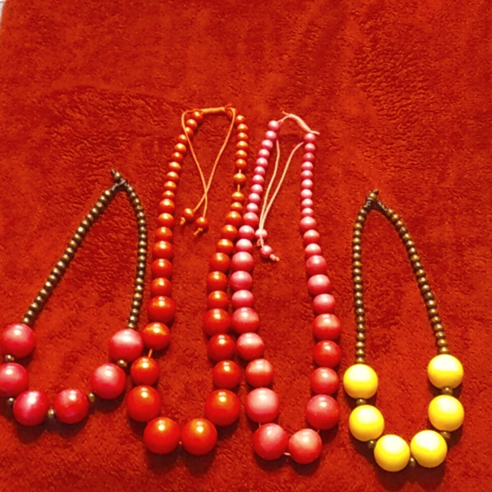 A lot of wooden necklaces